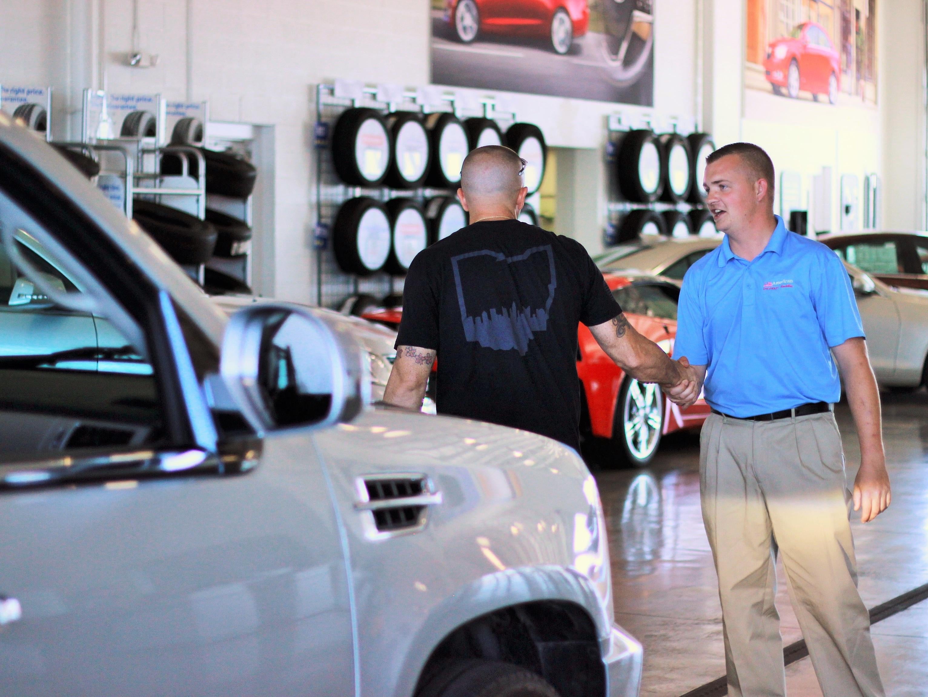 image of 2 men shaking hands